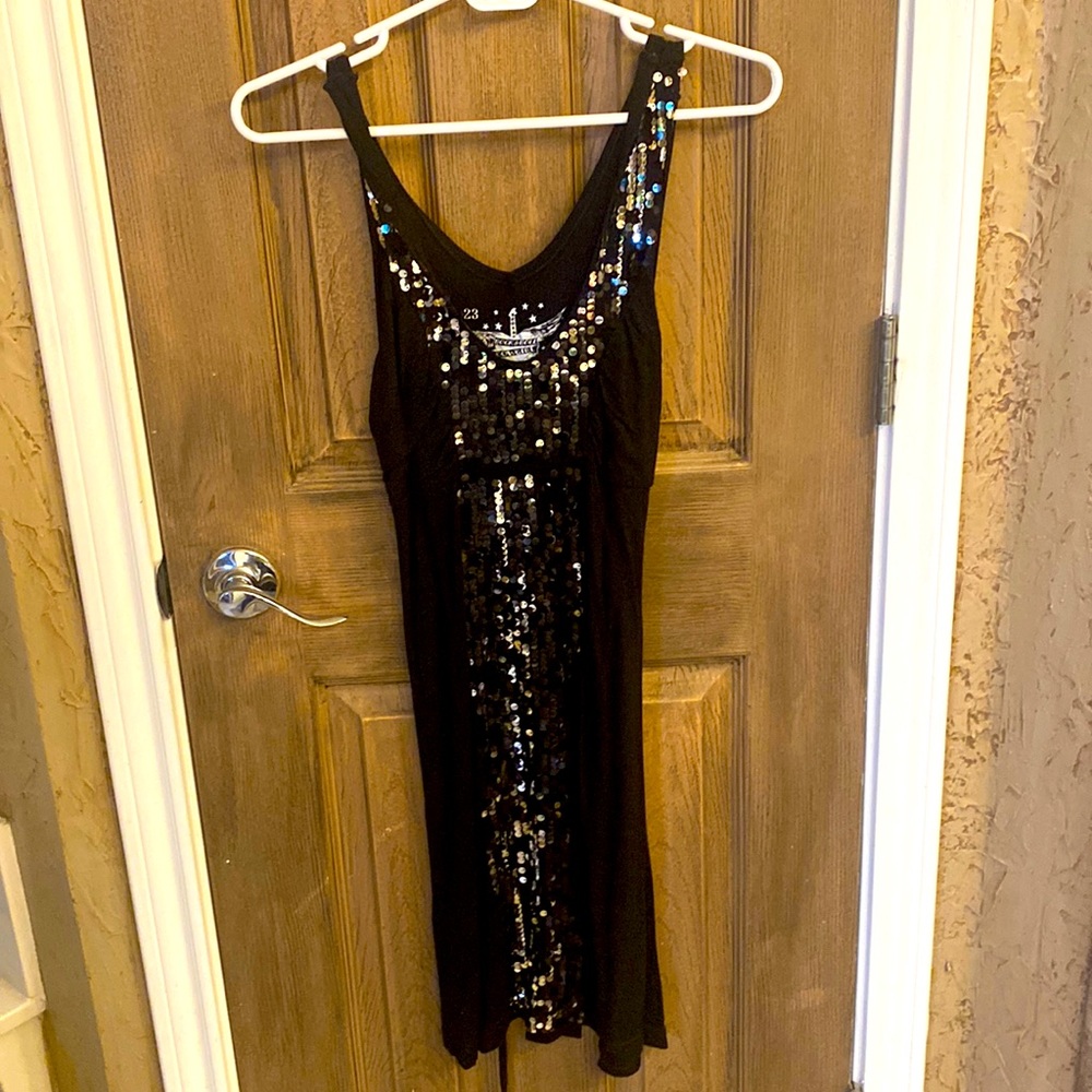 Fun black dress with sequins  down the front. Size medium made by panhandle slim